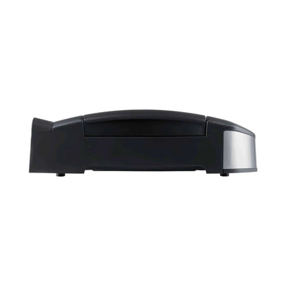 Black robotic vacuum cleaner with sleek modern design and metallic silver sensor beside Steba 2200W tabletop bbq grill vg195
