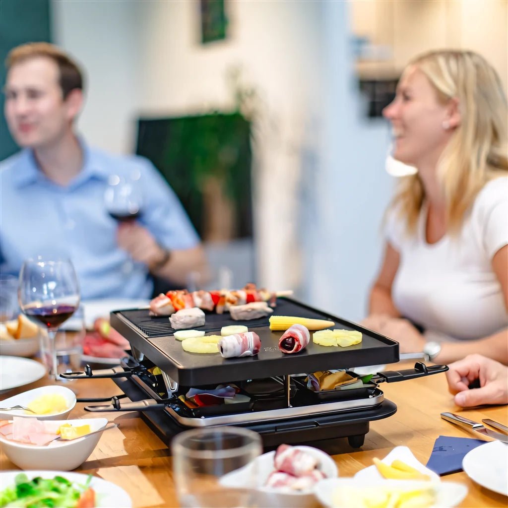 Black Steba RC28 premium electric cast raclette grill with multiple cooking zones and built-in serving trays