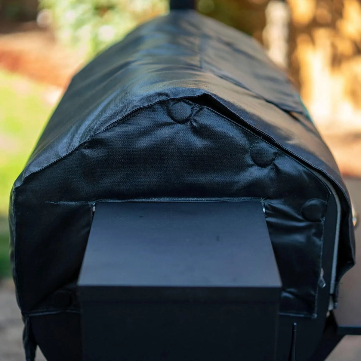Black thermal blanket for GMG pellet grills with reinforced stitching and snap closures protective cover