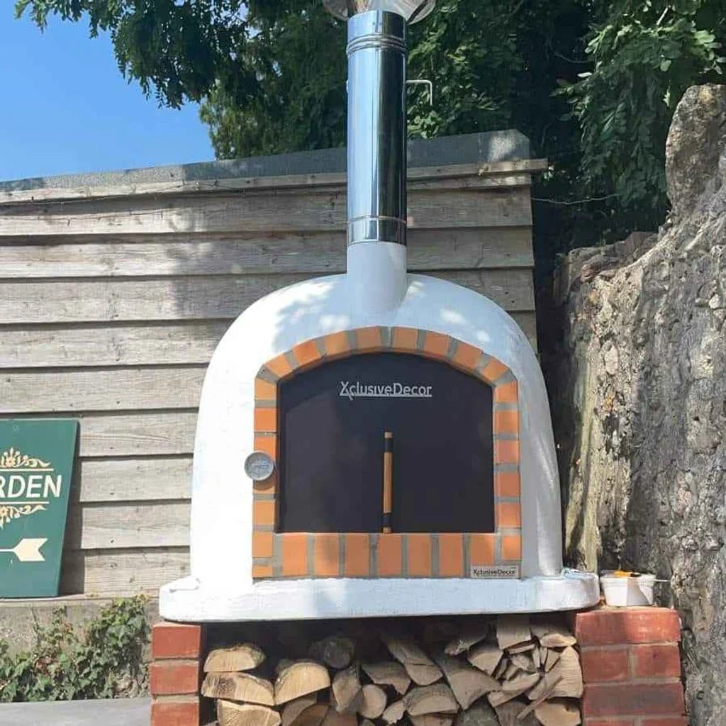 XclusiveDecor Bellissimo insulated brick pizza oven 100cm white ceramic with orange brick trim and stainless steel chimney