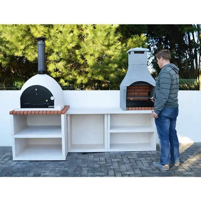 White outdoor wood fired pizza oven with black door and chimney on brick base in xclusivedecor napoli outdoor kitchen