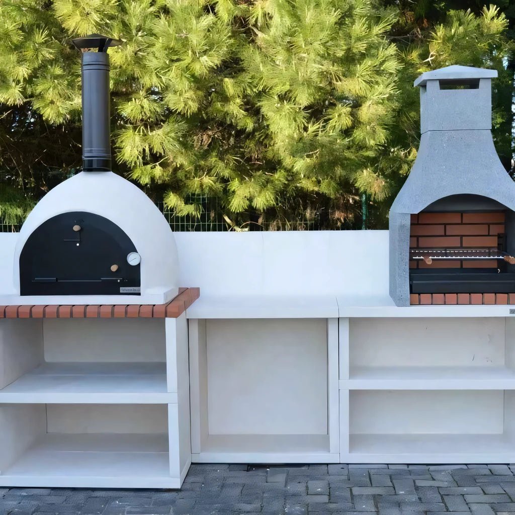 White outdoor pizza oven with black door and chimney built into white countertop with brick accents by XclusiveDecor