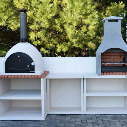 White outdoor pizza oven with black door and chimney built into white countertop with brick accents by XclusiveDecor