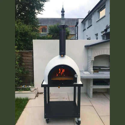 XclusiveDecor Royal mobile wood fired pizza oven in white ceramic with black metal frame and chimney on wheeled stand