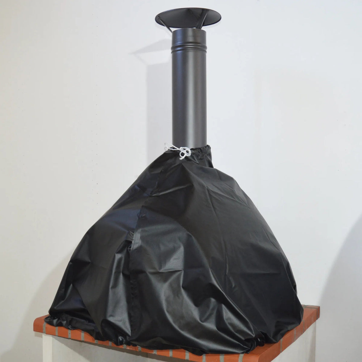 Black protective cover snugly fits over a sleek cylindrical chimney pipe for xclusivedecor royal pizza oven cover coverpom80